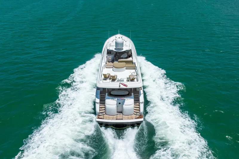 Slide: The Image of Luxury 2001 Lazzara 94 yacht cruising on turquoise waters, aerial view. - 2