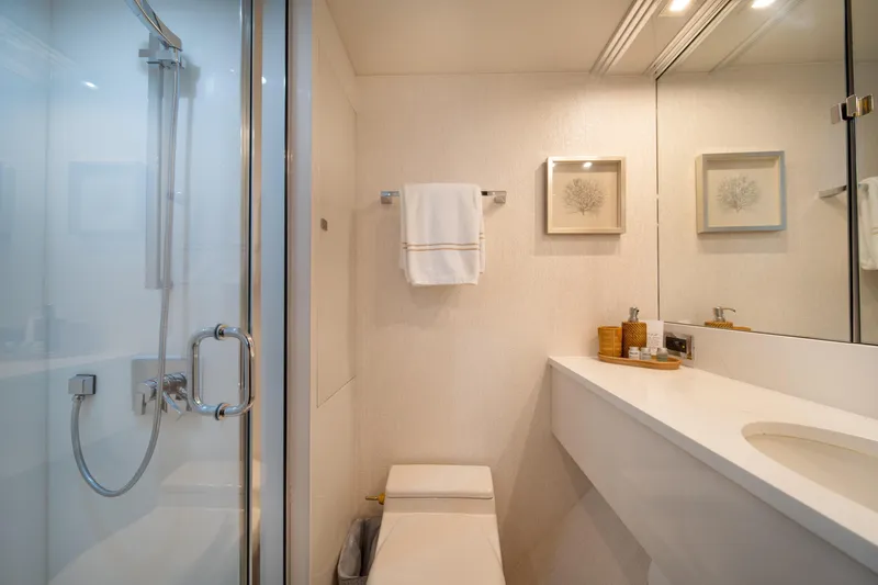 Slide: The Image of Luxurious bathroom on 2001 Lazzara 94 yacht with modern fixtures and elegant decor. - 29