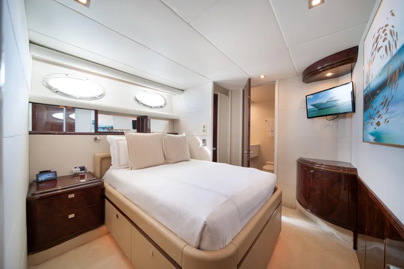 Slide: The Image of Luxurious bedroom interior of 2001 Lazzara 94 yacht with modern decor and amenities. - 30