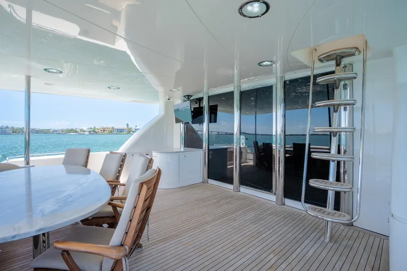 Slide: The Image of Luxurious 2001 Lazzara 94 yacht deck with elegant seating and ocean view. - 8