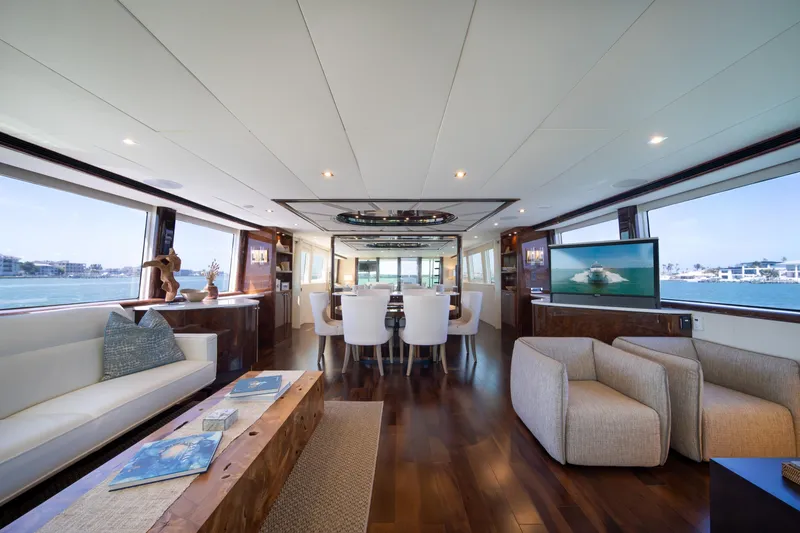 Slide: The Image of Luxurious interior of a 2001 Lazzara 94 yacht with elegant seating and panoramic windows. - 9