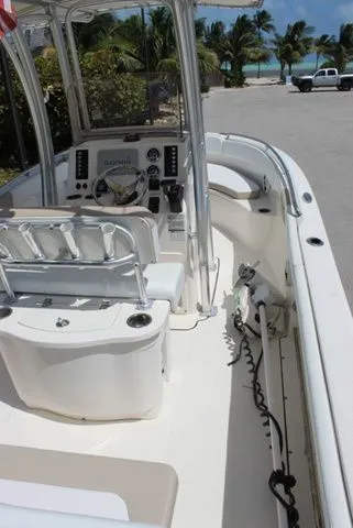 Slide: The Image of Interior view of a 2019 Robalo R222 boat by the beach. - 12