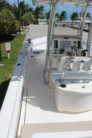 Slide: The Image of 2019 Robalo R222 boat near beach with palm trees. - 13