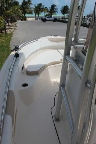 Slide: The Image of 2019 Robalo R222 boat with coastal view and palm trees. - 21