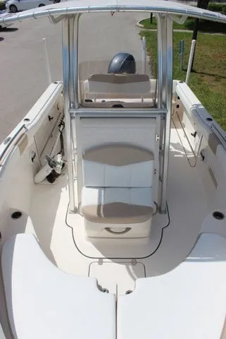 Slide: The Image of Interior view of a 2019 Robalo R222 boat with seating area. - 23
