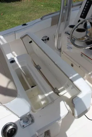 Slide: The Image of Interior of a 2019 Robalo R222 boat with open storage compartment. - 24