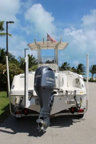 Slide: The Image of 2019 Robalo R222 boat with Yamaha engine, parked on a road. - 7