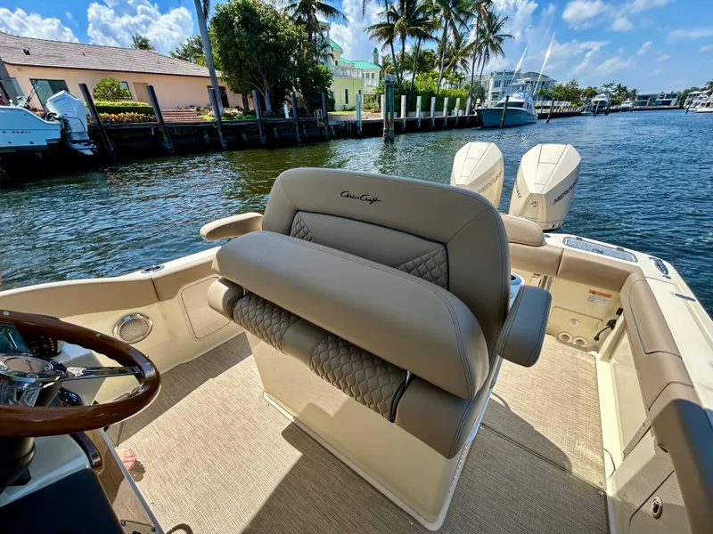 Slide: The Image of Chris-Craft Catalina 28, 2026, on water with palm trees in background. - 4