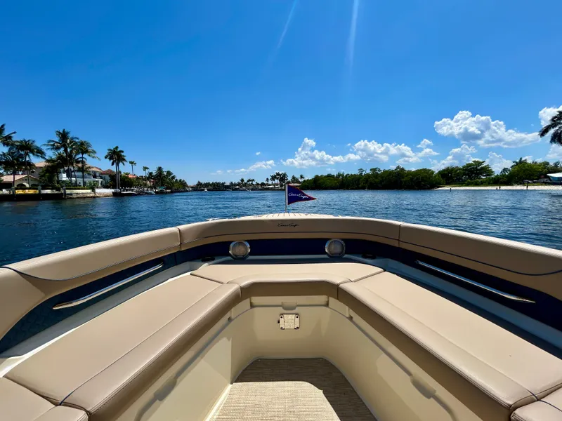 Slide: The Image of Chris-Craft Catalina 28, 2026, on calm waters with palm trees in the background. - 9