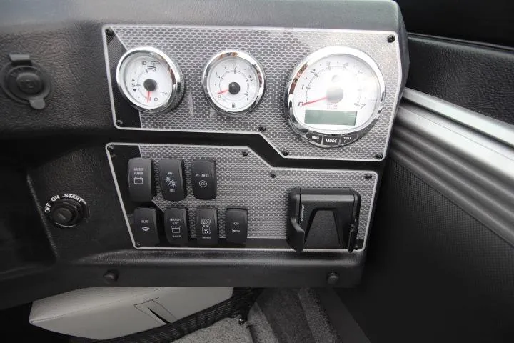Slide: The Image of Dashboard of 2026 Lund 2075 Tyee boat with gauges and control switches. - 5