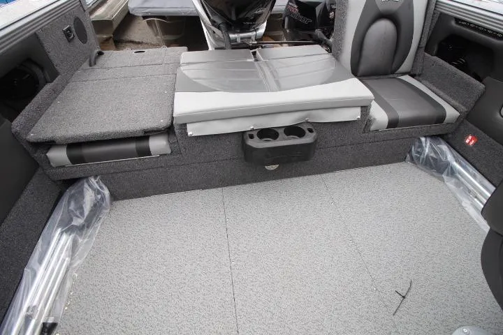 Slide: The Image of Interior of 2026 Lund 2075 Tyee boat with gray seating and cup holders. - 7