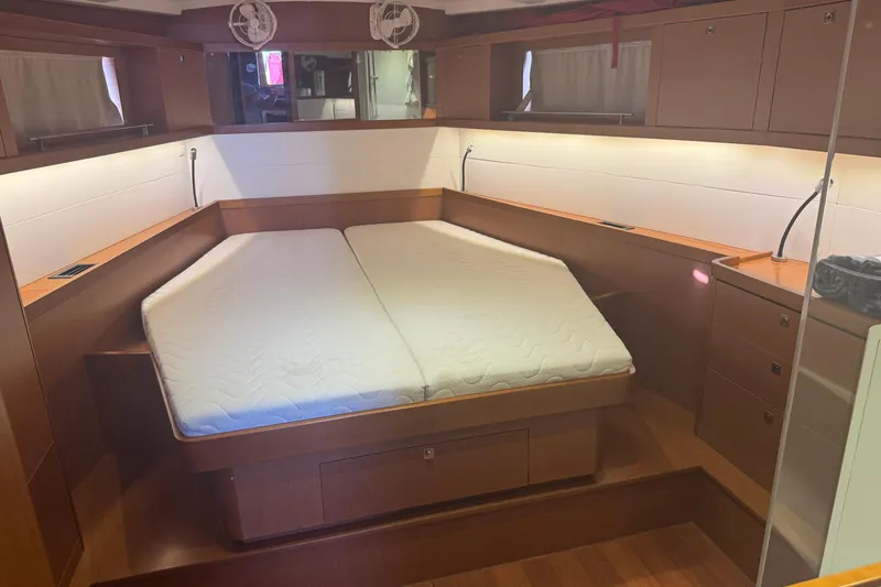 Slide: The Image of Luxurious cabin interior of a 2015 Beneteau Oceanis 48 yacht with a comfortable bed. - 11