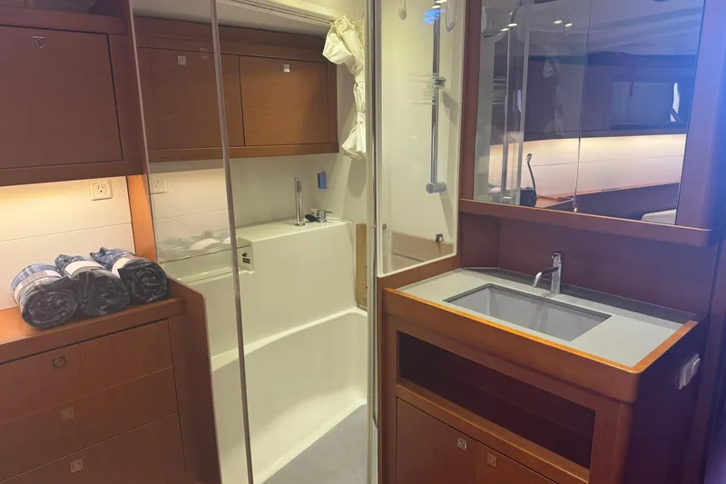 Slide: The Image of Luxurious bathroom interior of 2015 Beneteau Oceanis 48 yacht with modern fixtures. - 13