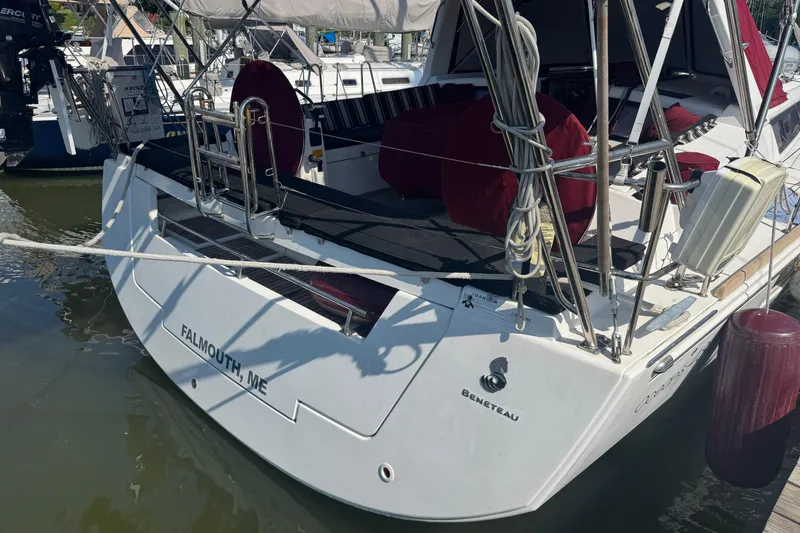 Slide: The Image of 2015 Beneteau Oceanis 48 sailboat docked in Falmouth, ME, featuring a spacious deck. - 21