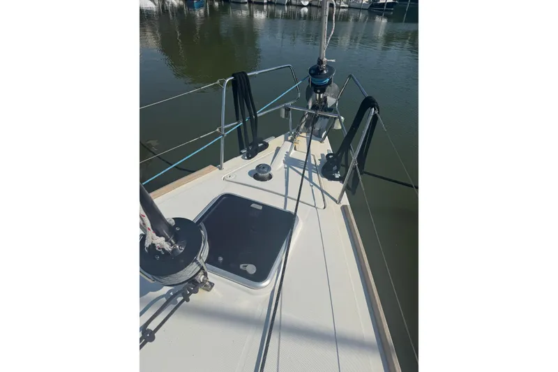 Slide: The Image of Bow view of 2015 Beneteau Oceanis 48 sailboat docked in marina. - 24