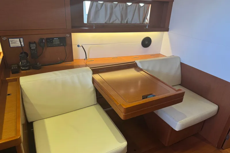 Slide: The Image of Interior of 2015 Beneteau Oceanis 48 yacht with seating and navigation equipment. - 4