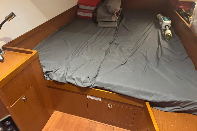Slide: The Image of Cabin interior of 2015 Beneteau Oceanis 48 with bed and storage. - 9