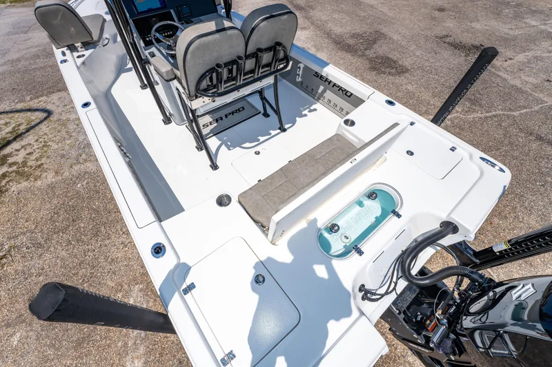 Slide: The Image of 2023 Sea Pro 248 Bay boat interior with seating and control panel. - 23