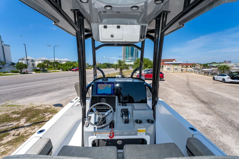 Slide: The Image of 2023 Sea Pro 248 Bay boat dashboard with modern controls and navigation system. - 26
