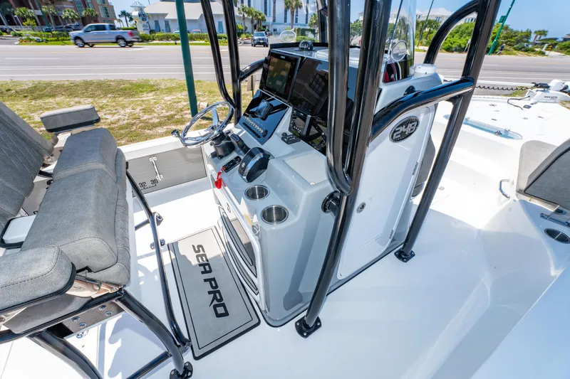 Slide: The Image of 2023 Sea Pro 248 Bay boat interior with modern console and seating. - 27