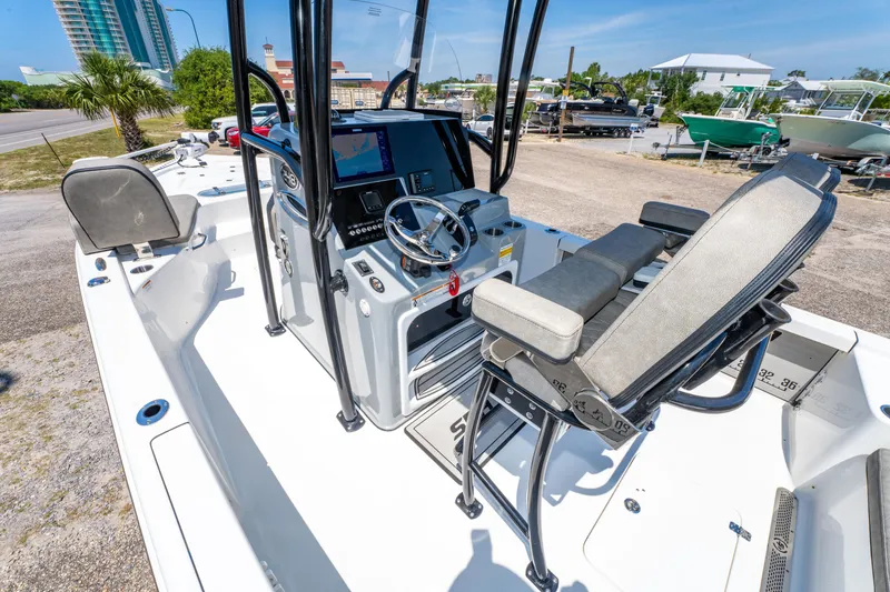 Slide: The Image of 2023 Sea Pro 248 Bay boat interior with modern helm and seating. - 28
