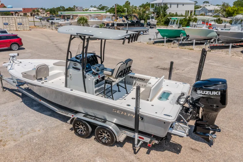 Slide: The Image of 2023 Sea Pro 248 Bay boat with Suzuki engine on trailer in marina. - 3