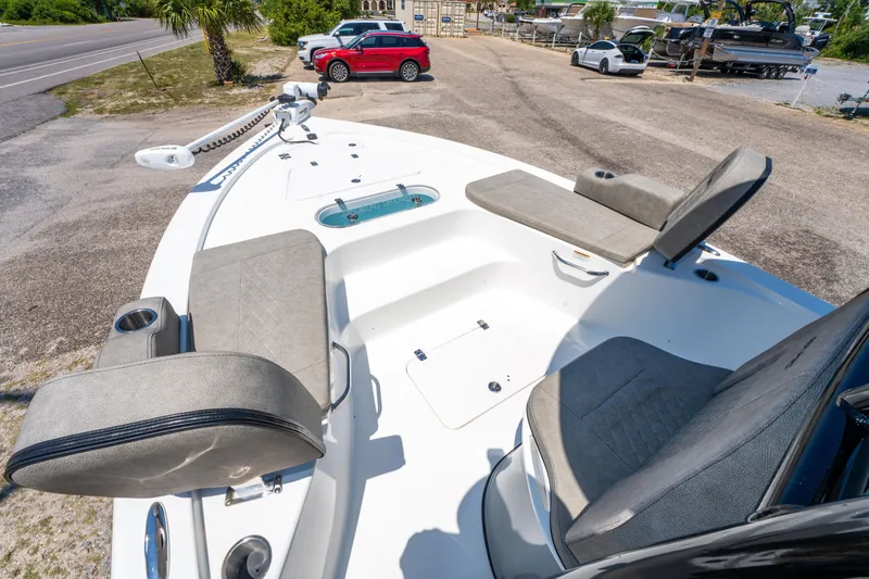 Slide: The Image of 2023 Sea Pro 248 Bay boat interior with seating and storage compartments. - 30