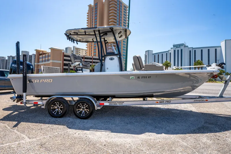 Slide: The Image of 2023 Sea Pro 248 Bay boat on trailer, urban background, sunny day. - 8