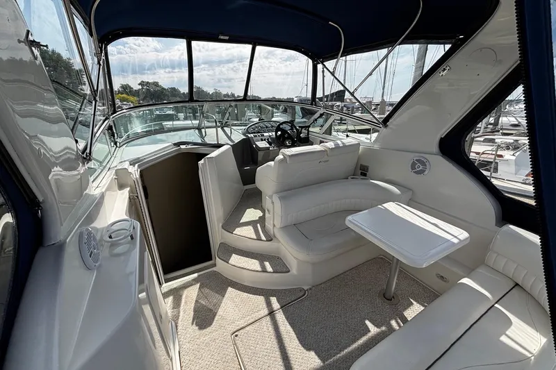 Slide: The Image of Interior of a 2005 Cruisers Yachts 280 CXi Express with seating area. - 11