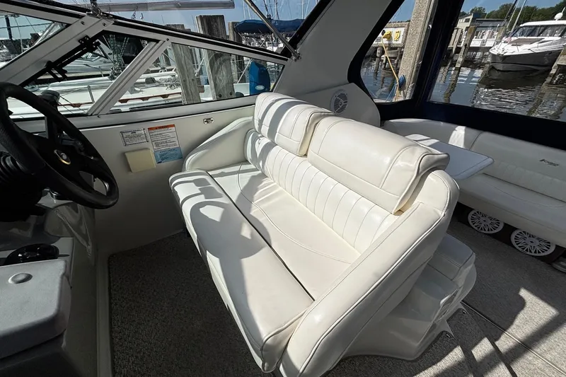 Slide: The Image of Interior of 2005 Cruisers Yachts 280 CXi Express with white leather seating. - 12