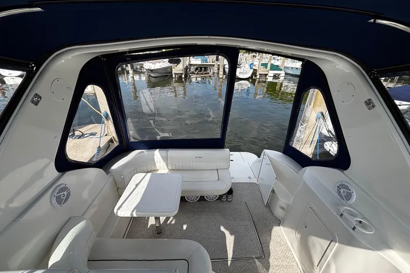 Slide: The Image of Interior of a 2005 Cruisers Yachts 280 CXi Express with harbor view. - 13