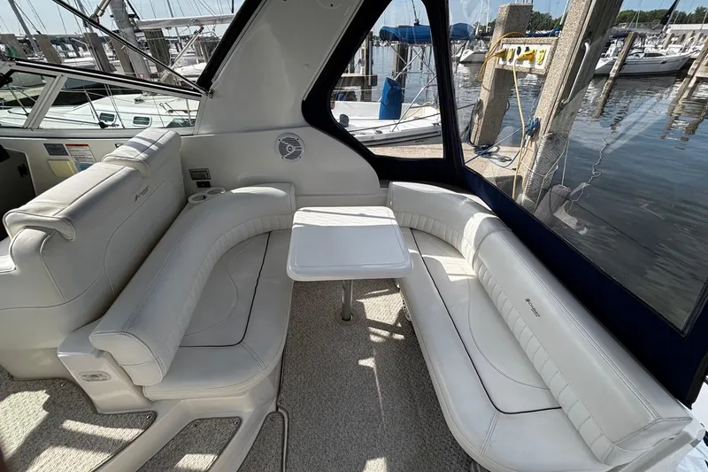 Slide: The Image of Interior of a 2005 Cruisers Yachts 280 CXi Express with white leather seating. - 14
