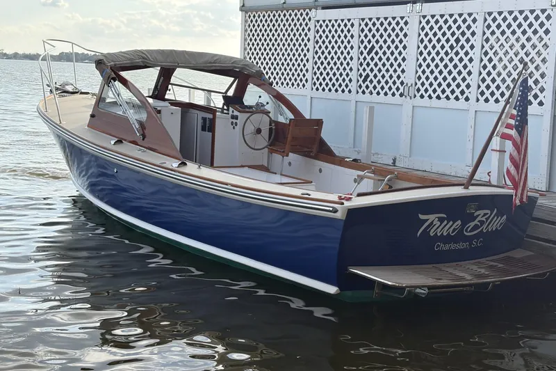Slide: The Image of 1973 Dyer 29 Bass Boat "True Blue" docked in Charleston, S.C., with American flag. - 7