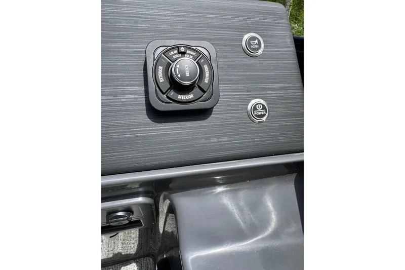 Slide: The Image of Control panel of 2026 Bennington S 23 SSR boat with buttons and dials. - 10