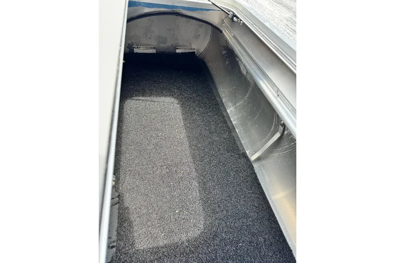 Slide: The Image of Interior view of 2026 Bennington S 23 SSR boat storage compartment. - 13