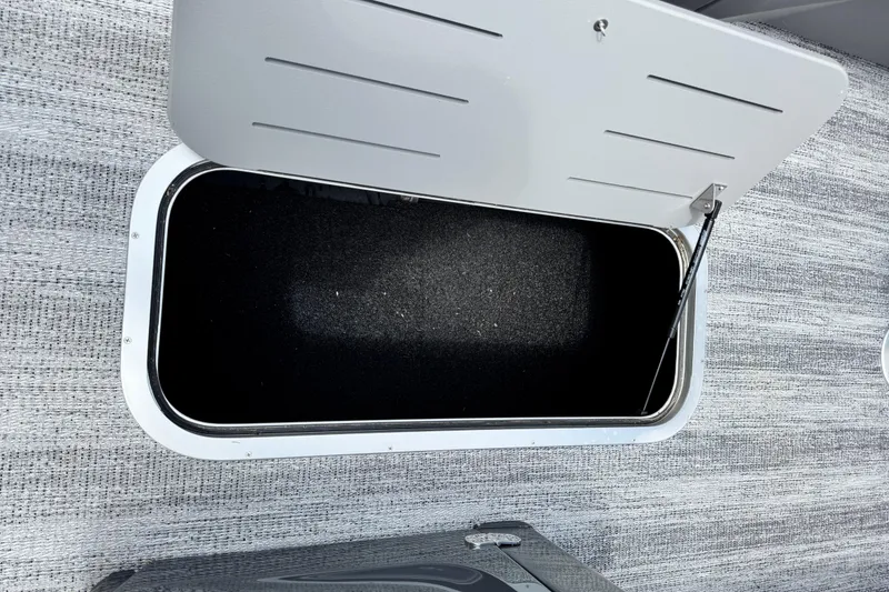 Slide: The Image of Open storage compartment on 2026 Bennington S 23 SSR boat. - 14