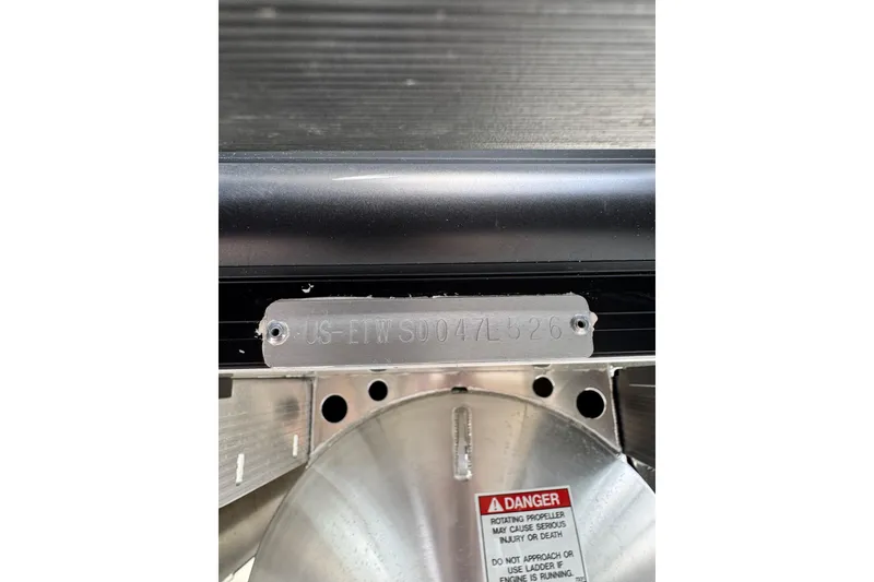 Slide: The Image of Hull identification number on a 2026 Bennington 23 boat, with safety warning label. - 15