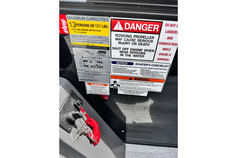 Slide: The Image of Safety warning labels and ignition switch on 2026 Bennington S 23 SSR boat. - 5