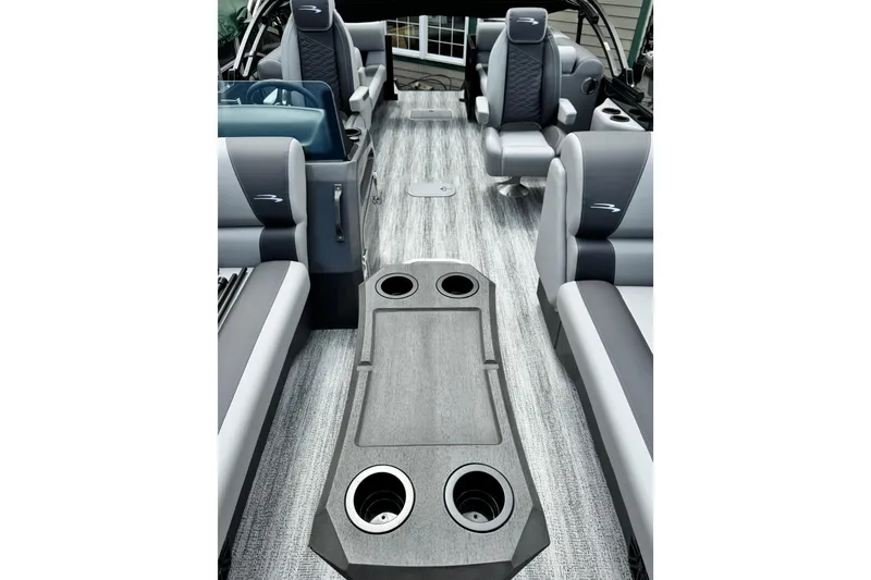 Slide: The Image of Interior of 2026 Bennington 23 boat with modern seating and cup holders. - 7
