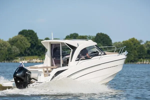 Slide: The Image of 2024 Beneteau Antarès 7 motorboat cruising on a lake. - 3