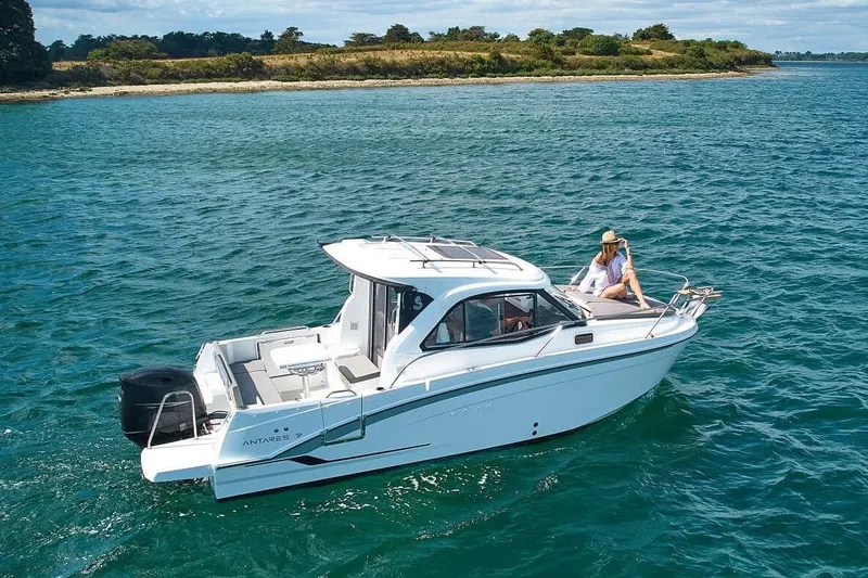 Slide: The Image of 2026 Beneteau Antares 7 boat on calm water with passenger. - 4