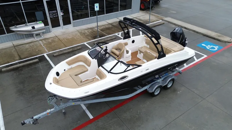 Slide: The Image of 2026 Bayliner VR6OB boat on trailer in parking lot. - 15