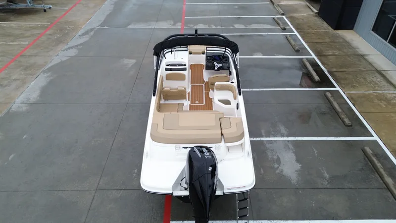 Slide: The Image of Aerial view of 2026 Bayliner VR6OB boat in parking lot. - 18
