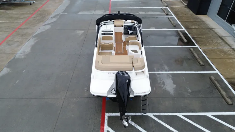Slide: The Image of Aerial view of 2026 Bayliner VR6OB boat in parking lot. - 19