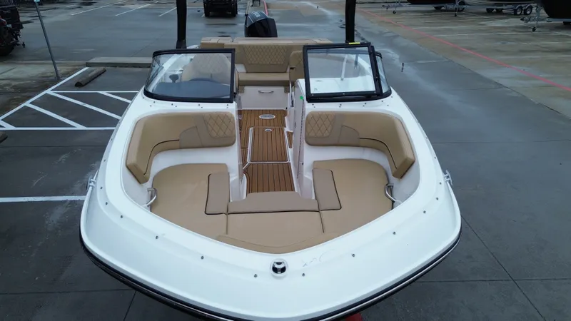 Slide: The Image of 2026 Bayliner VR6OB boat with beige interior on parking lot. - 21