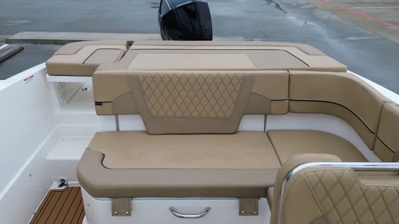 Slide: The Image of Interior of 2026 Bayliner VR6OB with beige upholstery. - 23