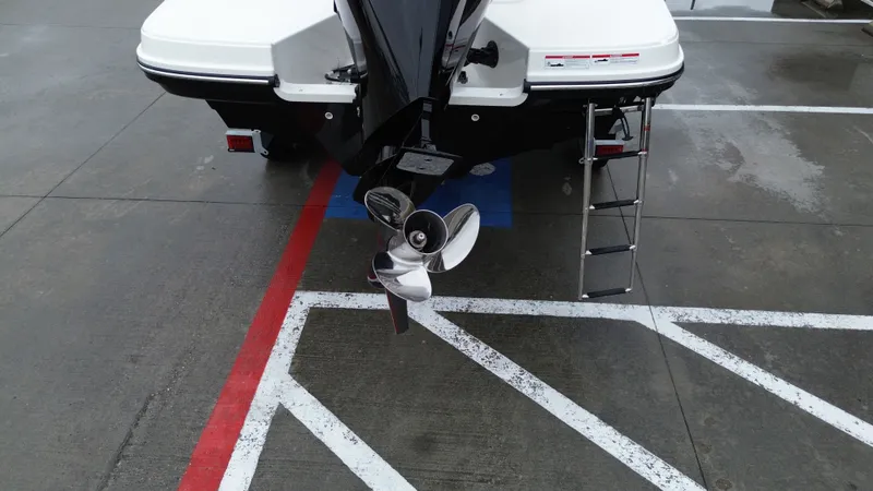 Slide: The Image of Rear view of a 2026 Bayliner VR6OB with outboard motor. - 24