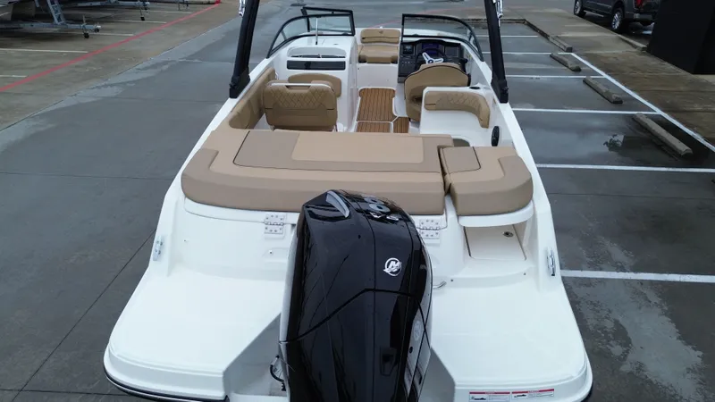 Slide: The Image of 2026 Bayliner VR6OB boat with outboard motor, beige upholstery. - 25