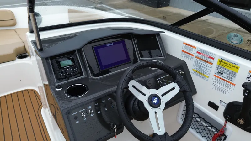 Slide: The Image of Interior view of 2026 Bayliner VR6OB helm with modern electronics. - 27