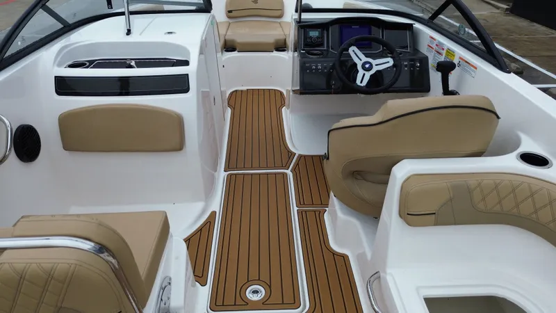 Slide: The Image of Interior of 2026 Bayliner VR6OB with modern seating and controls. - 28
